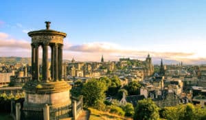 The Best Pub Guide - Take in a breathtaking sunset over Edinburgh, with the stunning Dugald Stewart Monument and the city skyline—Edinburgh Castle included—setting the perfect scene. Want to keep exploring? Check out our pub directory and uncover some brilliant local pubs as you make your way round this amazing city!. | Pub Directory UK