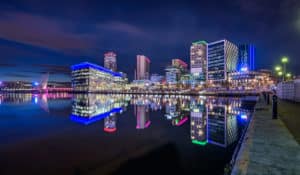 The Best Pub Guide - Soak in the night-time charm of Manchester’s waterfront, where sleek modern buildings glow in neon and their colourful reflections shimmer on peaceful waters. Wander along the riverside walkway, discovering an array of welcoming UK pubs—some proudly highlighted as Dog Friendly Pubs in our top-rated pub directory. Whether you’re after a lively spot for drinks or somewhere your four-legged friend can join the fun, there’s something special waiting just round the corner. | Pub Directory UK