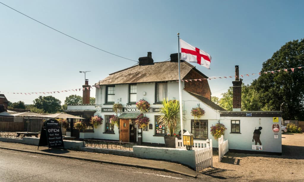 The Best Pub Guide - Explore timeless English pubs reminiscent of shutterstock_1523052170, complete with vibrant flower baskets, "The Knowledge" signage, St. George’s flags fluttering overhead, inviting outdoor seating, charming chalkboard specials, and cheerful bunting. Browse the top pub directories to discover your new favourite local!. | Pub Directory UK